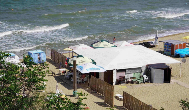 Nude Beach Bar - where you can order and eat nude on the left side