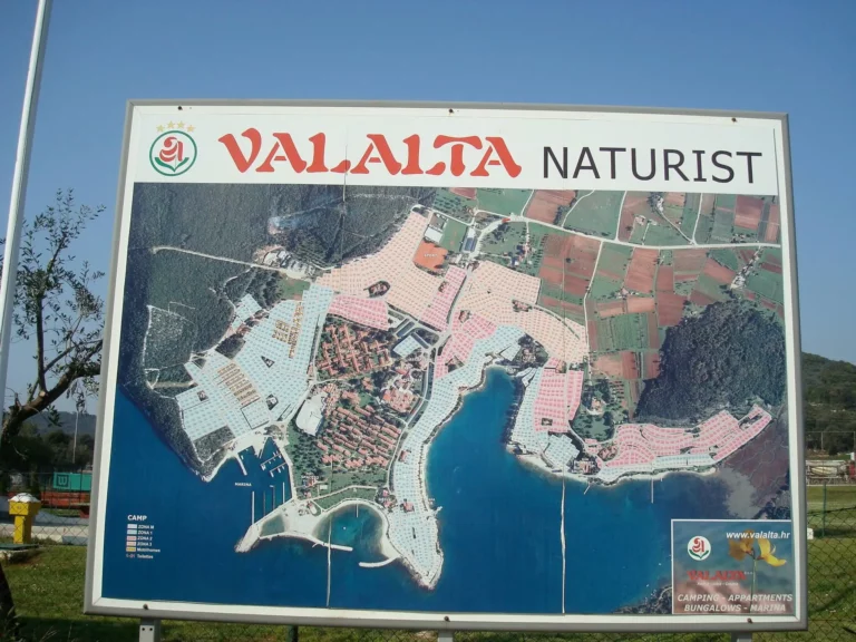 Welcome sign and map at Valalta Nude Beach