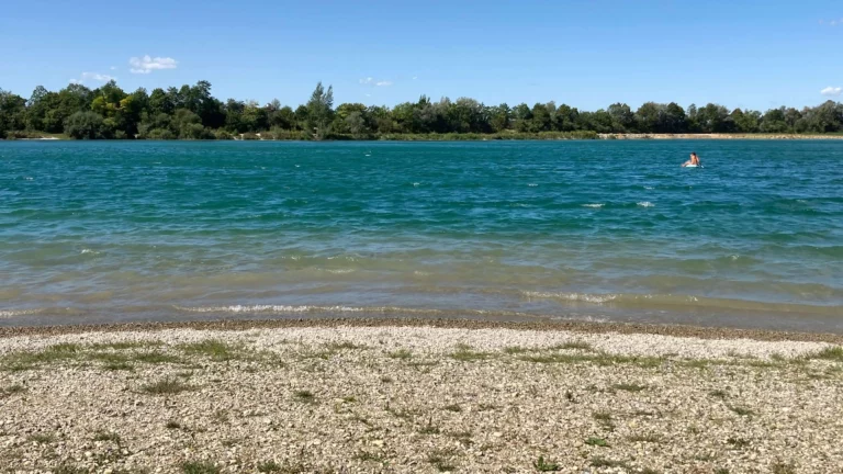 Crystal clear water at Pullinger Weiher nude beach in Munich