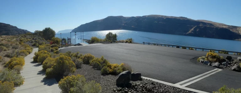 The trail to the nude beach begins at the end of the parking area