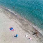 Soft sand and crystal clear water at Domaine Naturiste de Riva Bella