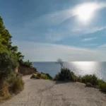 The steep drive down to Mirtiotissa Beach isn't for the faint of heart