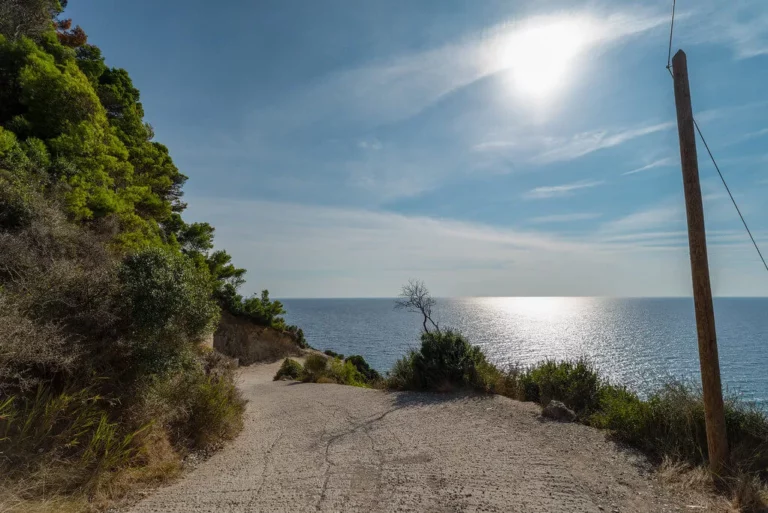 The steep drive down to Mirtiotissa Beach isn't for the faint of heart