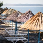 Plenty of shaded options at FKK Kandarola Beach