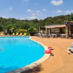 Pool area at Camping Petit Arlane