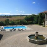 Clothing optional pool area at Naturist Hotel Peyraille